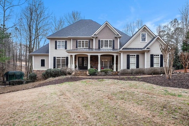 view of front of home featuring a front lawn and a porch