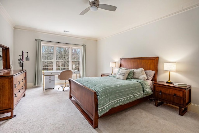 bedroom featuring crown molding, ceiling fan, and light carpet