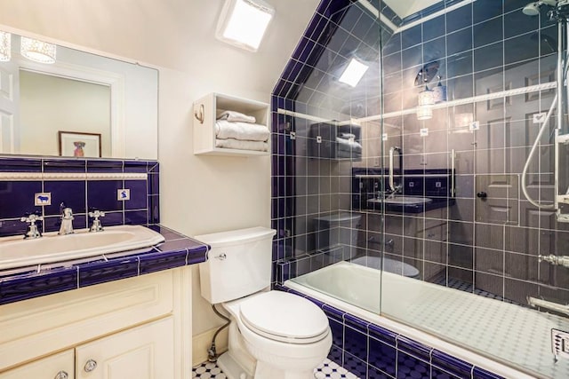 full bathroom with vanity, enclosed tub / shower combo, and toilet