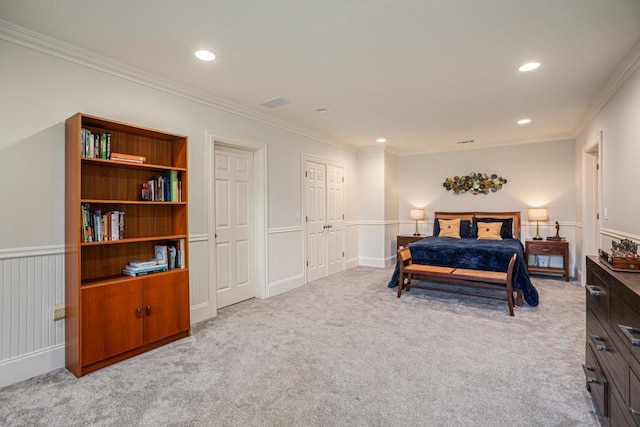 carpeted bedroom with ornamental molding