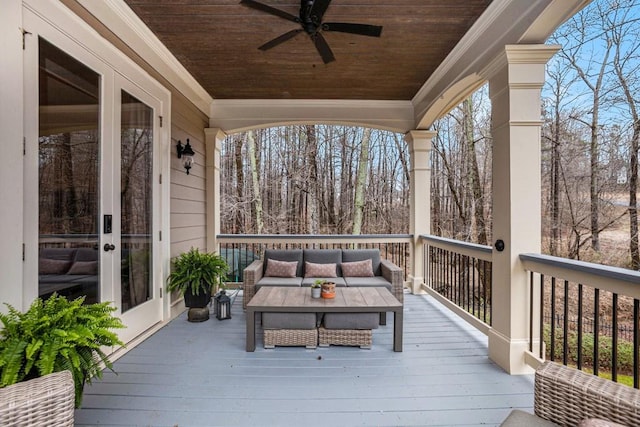 wooden deck featuring french doors, ceiling fan, and an outdoor living space