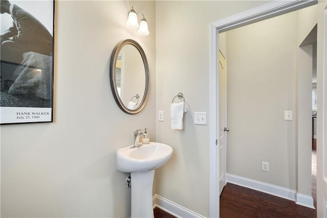 bathroom with wood-type flooring