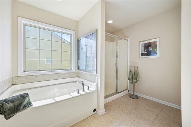 bathroom featuring tile patterned flooring and shower with separate bathtub