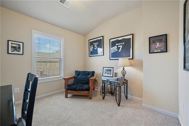 carpeted office featuring vaulted ceiling