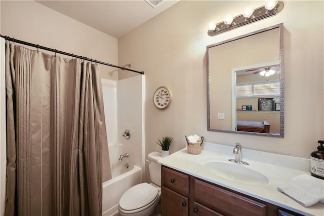 full bathroom featuring toilet, vanity, and shower / tub combo with curtain