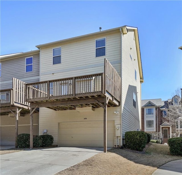 exterior space with a garage and a deck