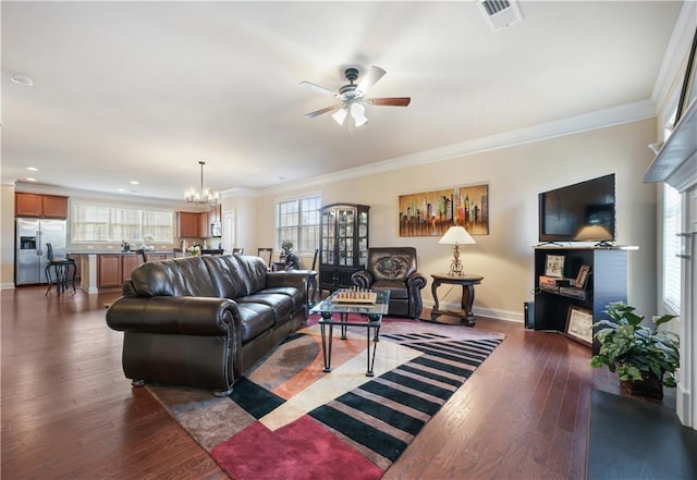 living room featuring ornamental molding, a healthy amount of sunlight, and dark hardwood / wood-style flooring