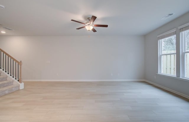 unfurnished room featuring ceiling fan and light wood-type flooring