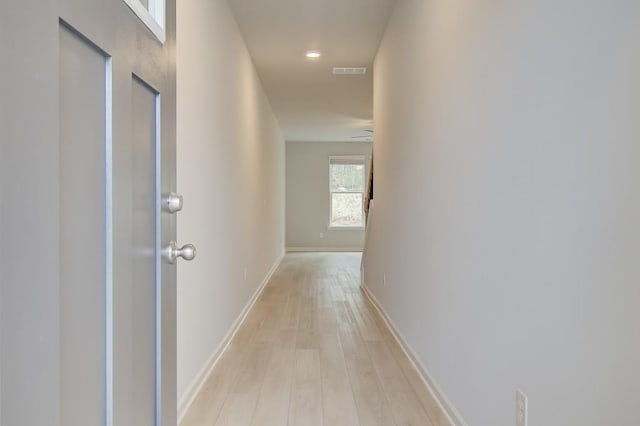 hall with light wood-type flooring