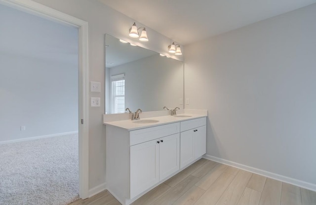 bathroom featuring vanity and wood-type flooring