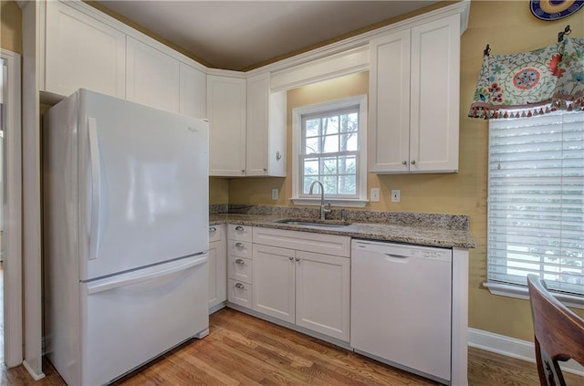 27 Planters Dr NW, Cartersville, GA 30120 - kitchen featuring white appliances, a sink, light wood finished floors, white cabinetry, and light stone countertops