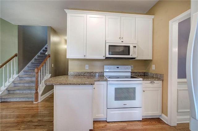 27 Planters Dr NW, Cartersville, GA 30120 - kitchen with white appliances, white cabinets, and light wood-type flooring