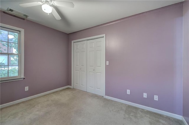 27 Planters Dr NW, Cartersville, GA 30120 - unfurnished bedroom with light colored carpet, baseboards, a closet, and ceiling fan