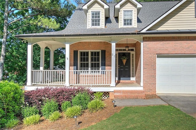 27 Planters Dr NW, Cartersville, GA 30120 - view of front facade with a porch, brick siding, roof with shingles, and a garage