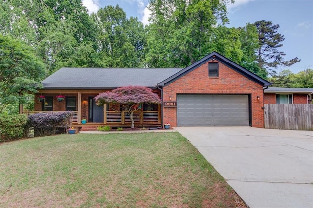 ranch-style home featuring an attached garage, brick siding, driveway, and covered porch