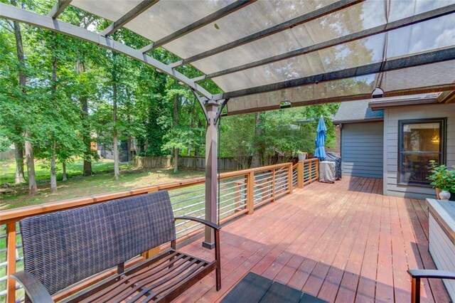 view of patio / terrace featuring a deck, fence, and a pergola