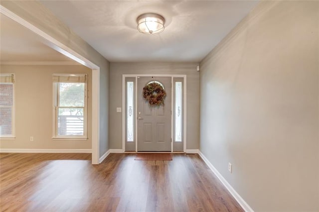 entryway with wood finished floors and baseboards