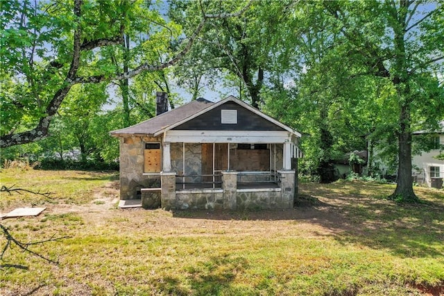 1162 Joseph E Boone Blvd NW, Atlanta, GA 30314 - bungalow-style home with a sunroom, a front yard, and stone siding