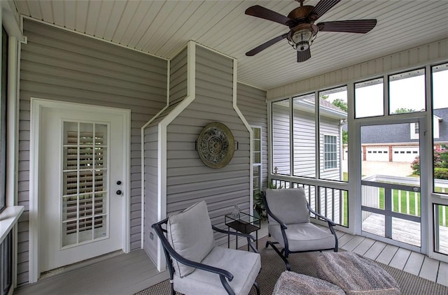 sunroom / solarium with ceiling fan