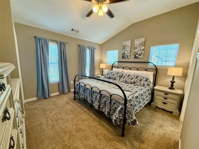 bedroom featuring carpet, vaulted ceiling, baseboards, and ceiling fan
