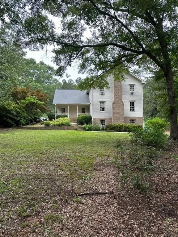 2377 Centerville Rosebud Rd, Loganville, GA 30052 - view of front facade featuring a front yard and a porch