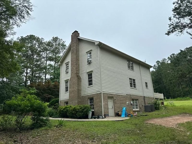 2377 Centerville Rosebud Rd, Loganville, GA 30052 - view of side of property with a chimney and a yard