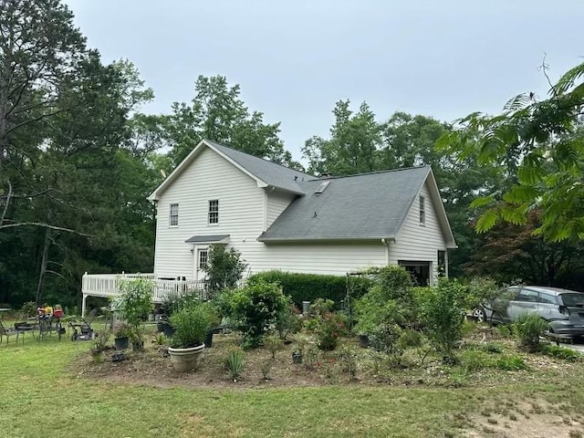2377 Centerville Rosebud Rd, Loganville, GA 30052 - back of house with roof with shingles, a deck, and a yard