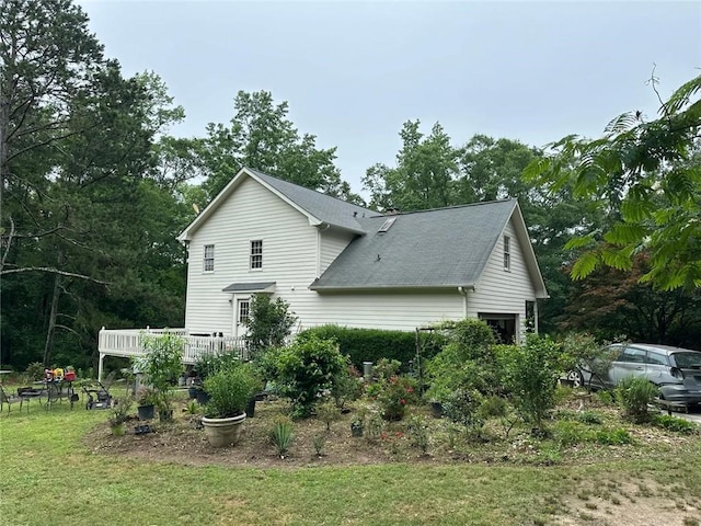 2377 Centerville Rosebud Rd, Loganville, GA 30052 - rear view of property with a shingled roof, a yard, and a deck
