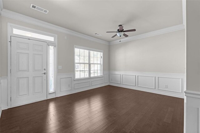 entryway featuring ceiling fan, ornamental molding, and dark hardwood / wood-style flooring