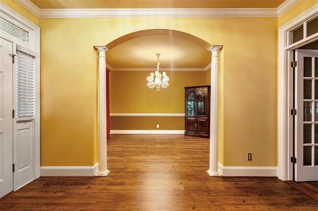 unfurnished dining area with decorative columns, dark hardwood / wood-style floors, and ornamental molding