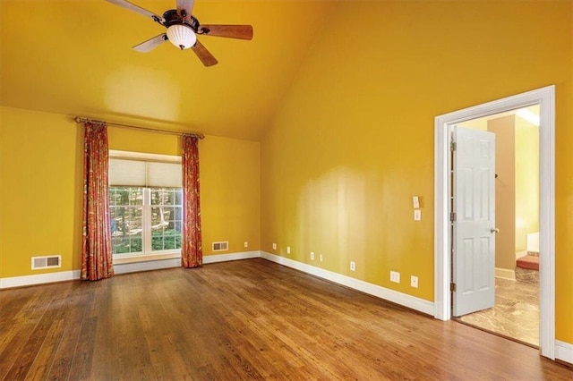 interior space with ceiling fan, hardwood / wood-style flooring, and high vaulted ceiling