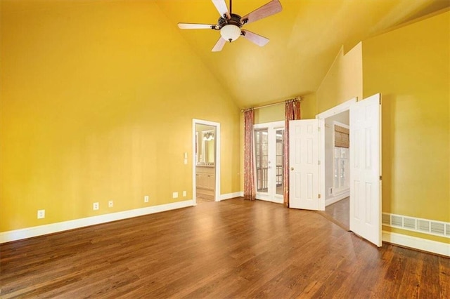 interior space featuring high vaulted ceiling, dark hardwood / wood-style floors, ensuite bath, and ceiling fan