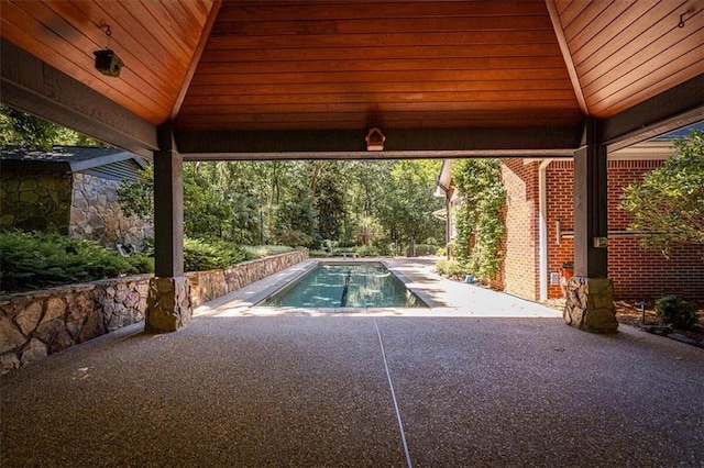 view of swimming pool with a gazebo and a patio