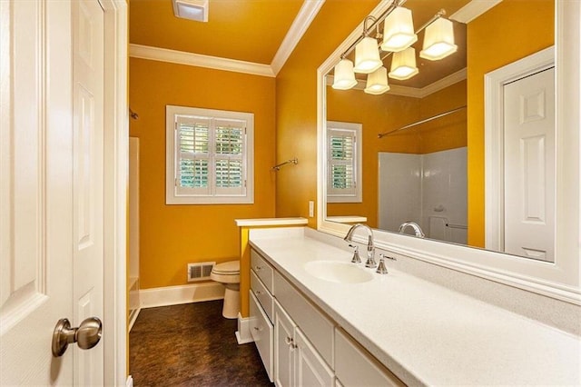 bathroom featuring toilet, ornamental molding, and vanity