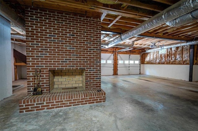 garage featuring a brick fireplace