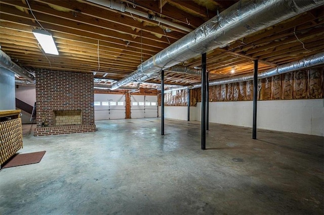 basement with a brick fireplace