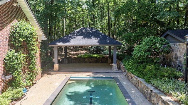 view of swimming pool featuring a gazebo