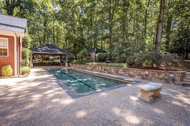 view of swimming pool featuring a gazebo and a patio