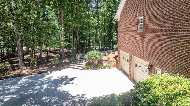 view of side of property with a garage