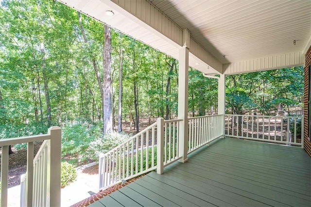 wooden terrace featuring a porch