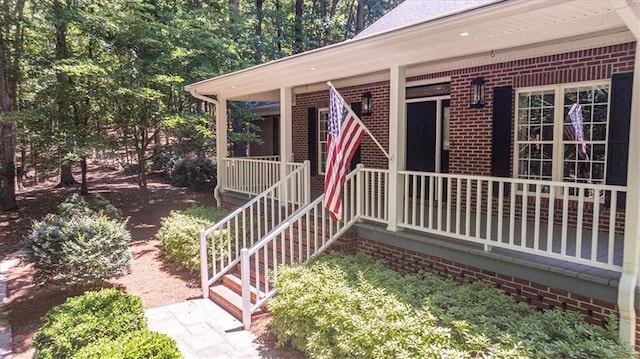 property entrance featuring covered porch