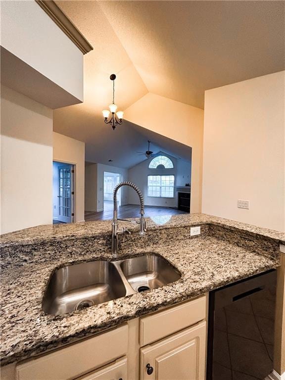3077 Oakside Cir, Alpharetta, GA 30004 - kitchen featuring a sink, dishwasher, stone countertops, pendant lighting, and lofted ceiling