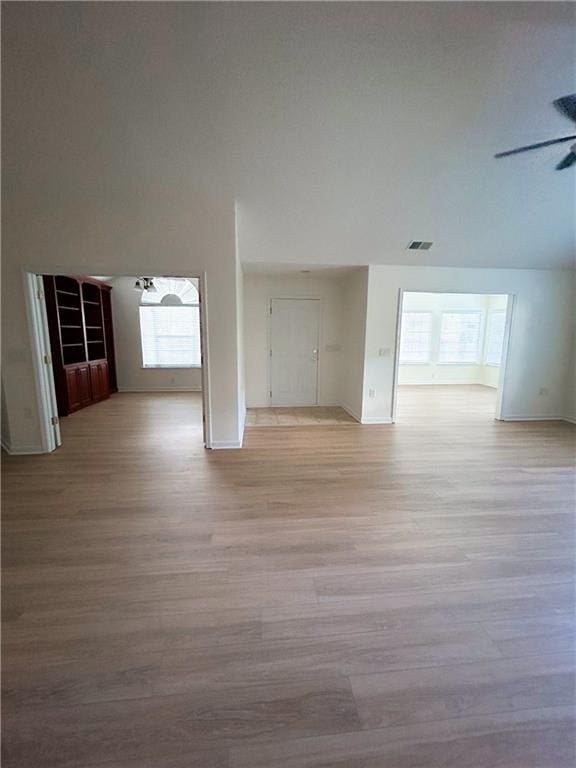 3077 Oakside Cir, Alpharetta, GA 30004 - unfurnished living room with healthy amount of natural light, light wood-style floors, and baseboards