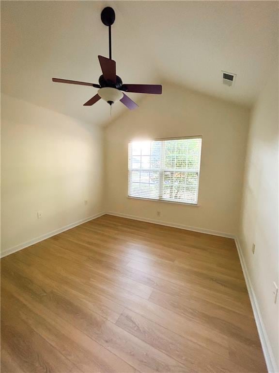 3077 Oakside Cir, Alpharetta, GA 30004 - unfurnished room featuring light wood-style floors, a ceiling fan, vaulted ceiling, and baseboards