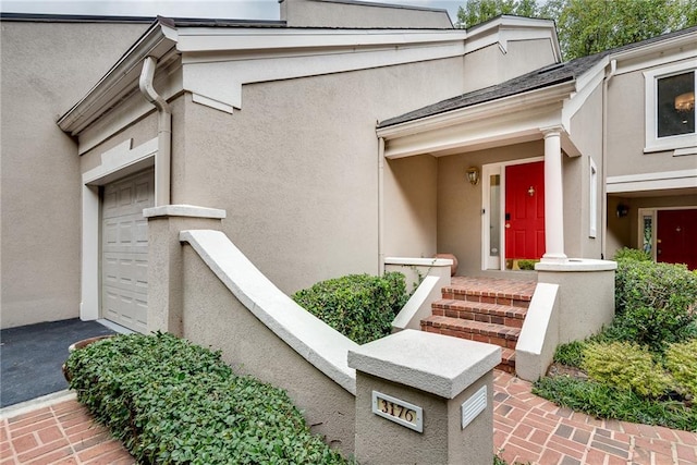 doorway to property featuring a garage