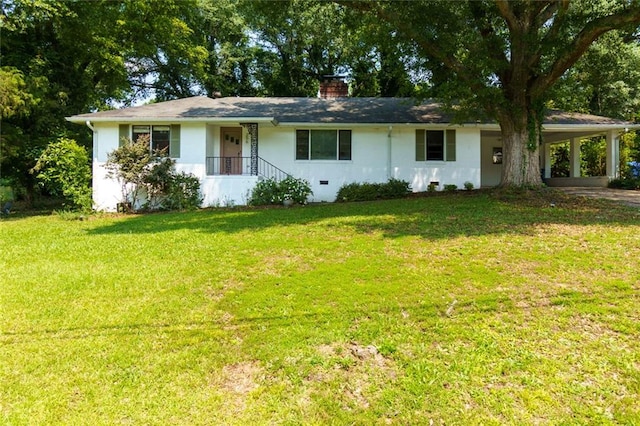 256 4th Ave, Winder, GA 30680 - ranch-style house with a front lawn, a chimney, a carport, driveway, and stucco siding