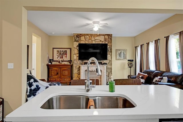 kitchen with ceiling fan and sink