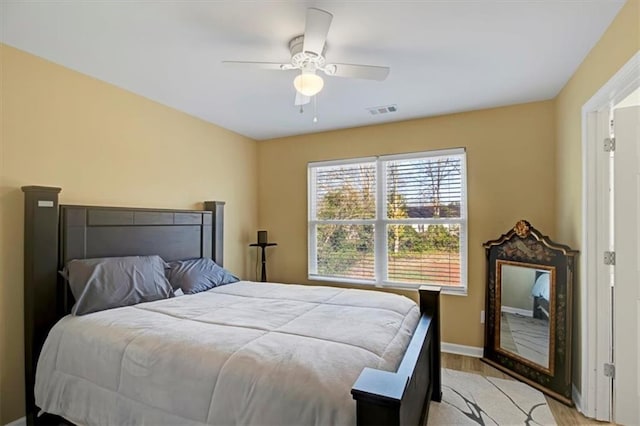 bedroom featuring ceiling fan and light hardwood / wood-style floors