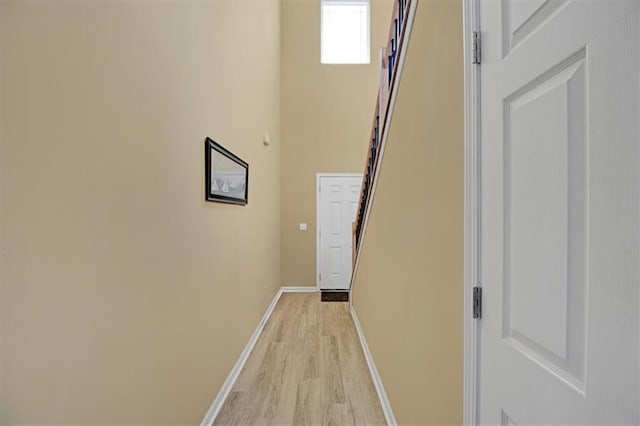 hall with light hardwood / wood-style floors