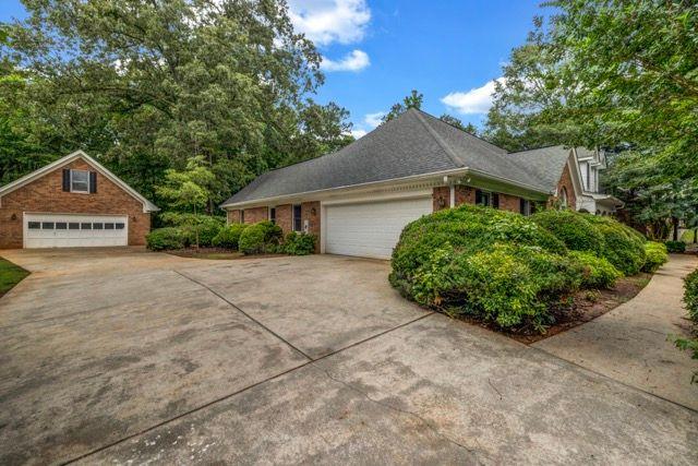 362 Clyde Ct, Mcdonough, GA 30252 - view of property exterior with a garage